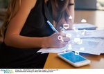 Businesswoman working an office with mobile app icons